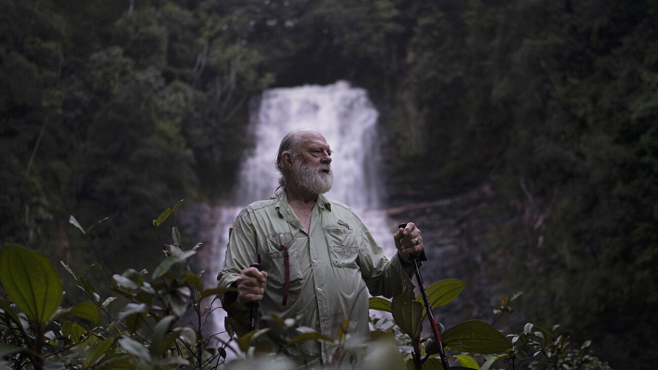 Biologist Bruce Means in front of the pristine Double Drop Falls of Guyana. (National Geographic/RYAN VALASEK)