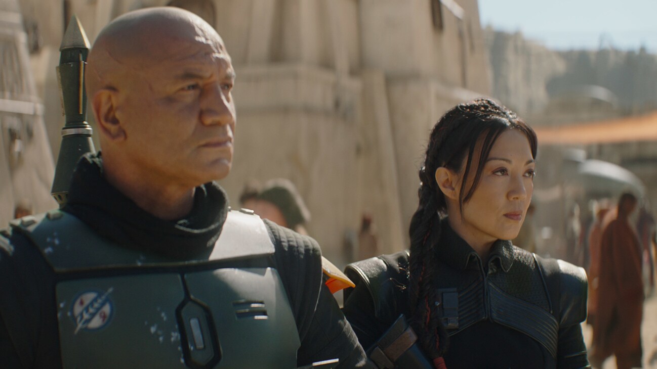 (L-R): Temura Morrison is Boba Fett and Ming-Na Wen is Fennec Shand in Lucasfilm's THE BOOK OF BOBA FETT, exclusively on Disney+. © 2021 Lucasfilm Ltd. & ™. All Rights Reserved.