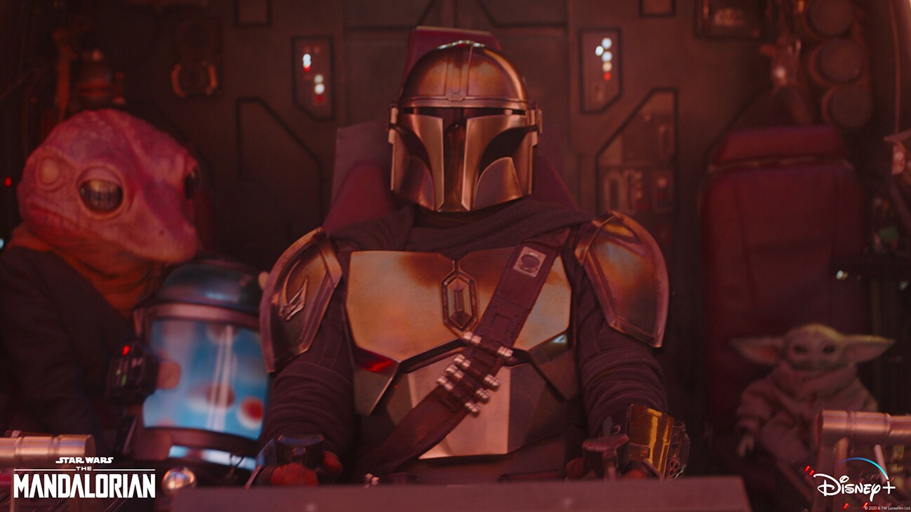 Frog Lady, the Mandalorian (Pedro Pascal) and The Child in Lucasfilm's THE MANDALORIAN, season two, exclusively on Disney+. © 2020 Lucasfilm Ltd. & ™. All Rights Reserved.