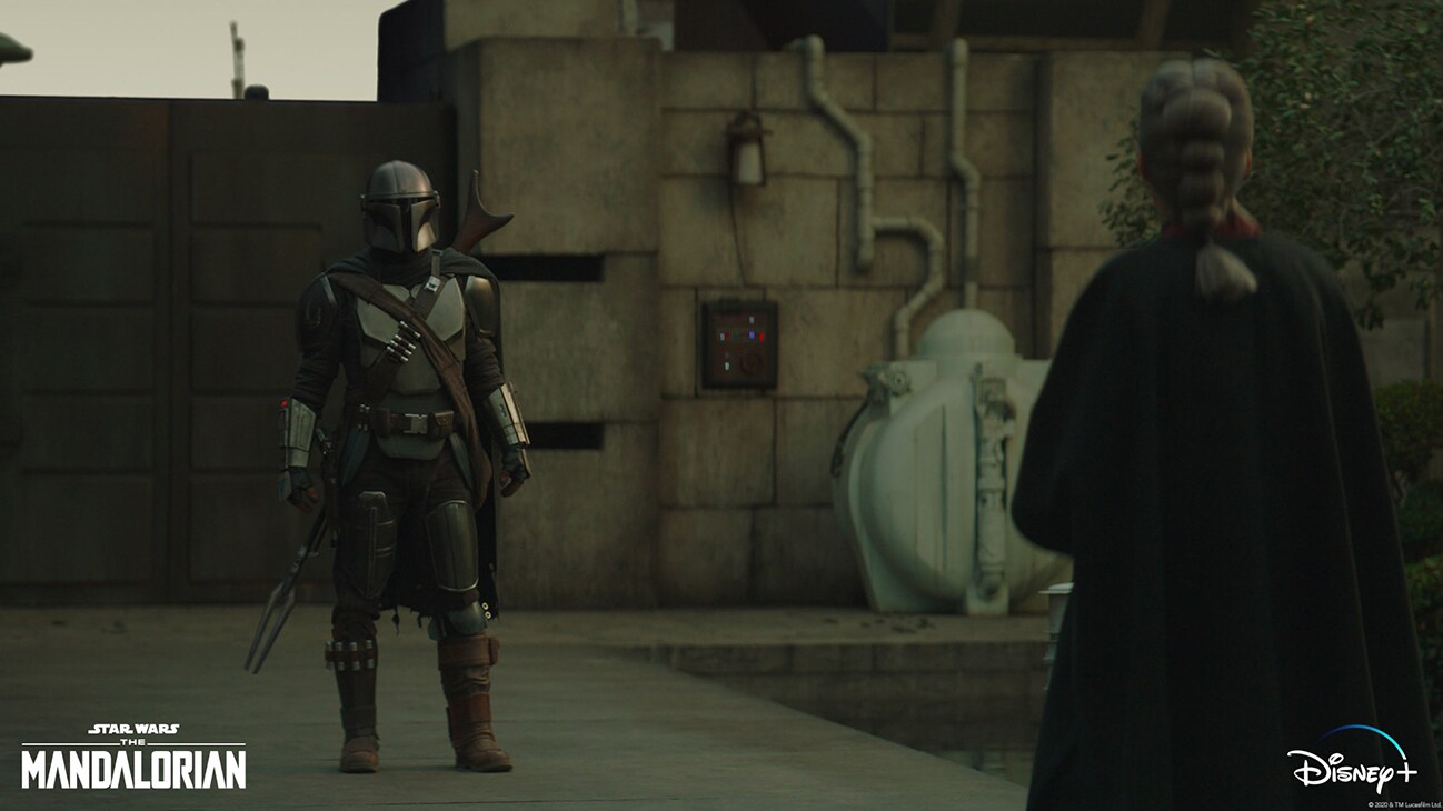 The Mandalorian (Pedro Pascal) and The Magistrate (Diana Lee Inosanto) in Lucasfilm's THE MANDALORIAN, season two, exclusively on Disney+. © 2020 Lucasfilm Ltd. & ™. All Rights Reserved.