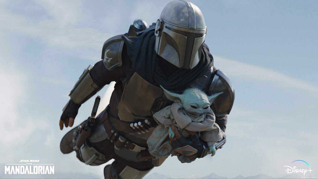 The Mandalorian (Pedro Pascal) and Grogu in Lucasfilm's THE MANDALORIAN, season two, exclusively on Disney+. © 2020 Lucasfilm Ltd. & ™. All Rights Reserved.