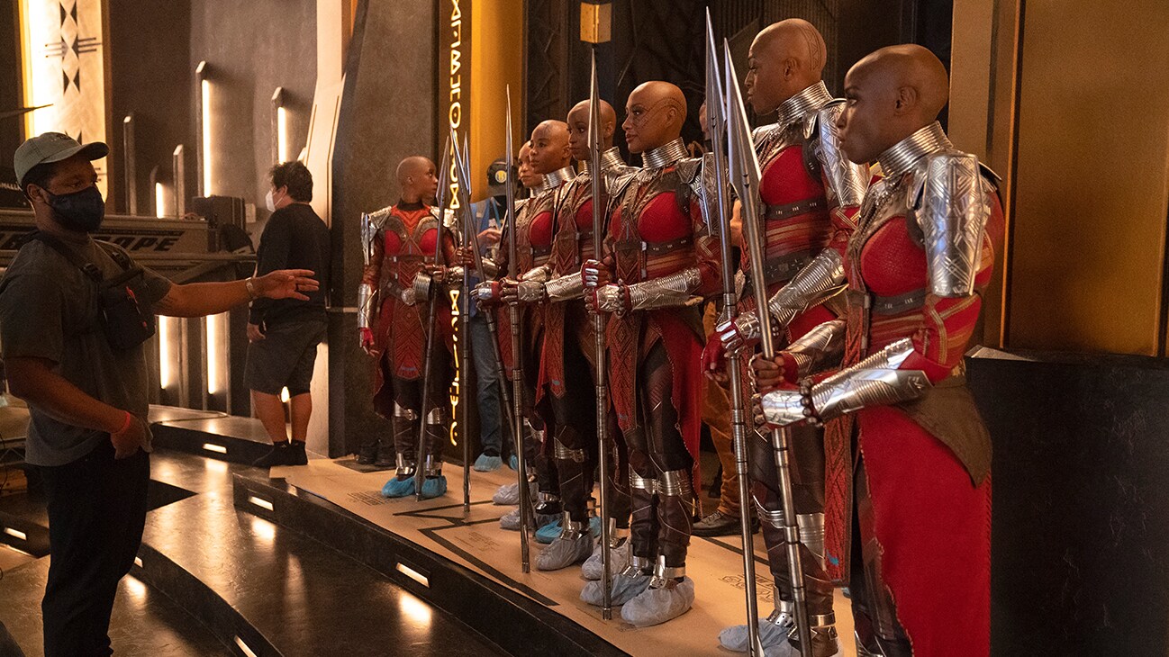 Behind-the-scenes image of the Dora Milaje on set, from the film, Marvel Studios' Black Panther: Wakanda Forever.