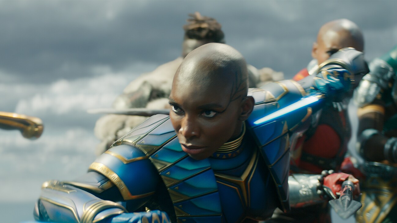 Aneka (actor Michaela Coel) takes a defensive stance with her blade drawn. From the film, Marvel Studios' Black Panther: Wakanda Forever.
