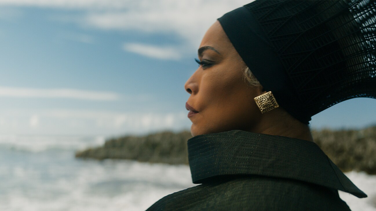 Queen Ramonda (actor Angela Bassett) looks towards the sea. From the film, Marvel Studios' Black Panther: Wakanda Forever.