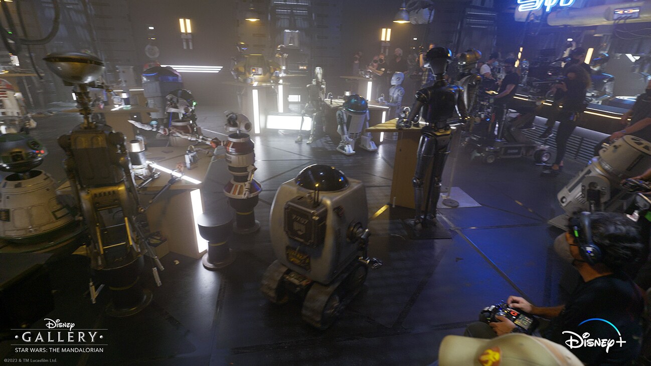 Image of droids in a droid bar from the Disney+ Original series, "Disney Gallery - Star Wars: The Mandalorian Season 3."