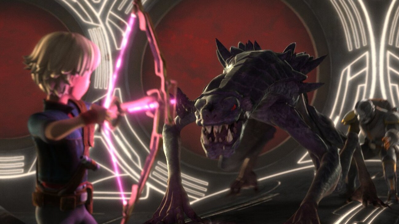Omega aiming her energy bow at a creature from the Disney+ Original series, "Star Wars: The Bad Batch" season 2, episode 5.
