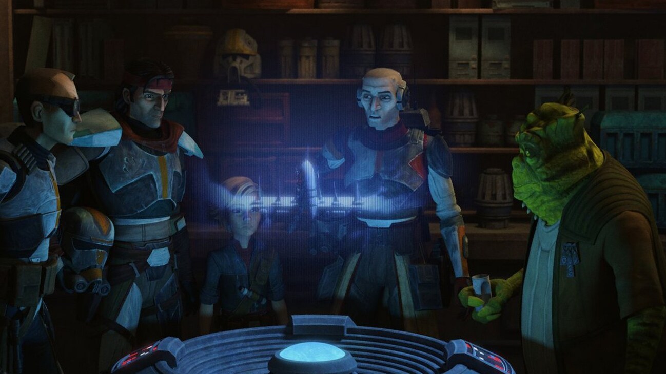 Cid and Clone Force 99 look at a holo screen in the Disney+ Original series, Star Wars: The Bad Batch.