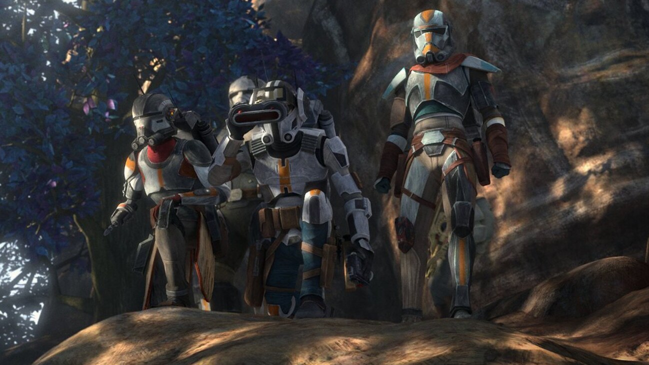 The Bad Batch clone troopers looking down a shaded hill in the Disney+ Original series, Star Wars: The Bad Batch.