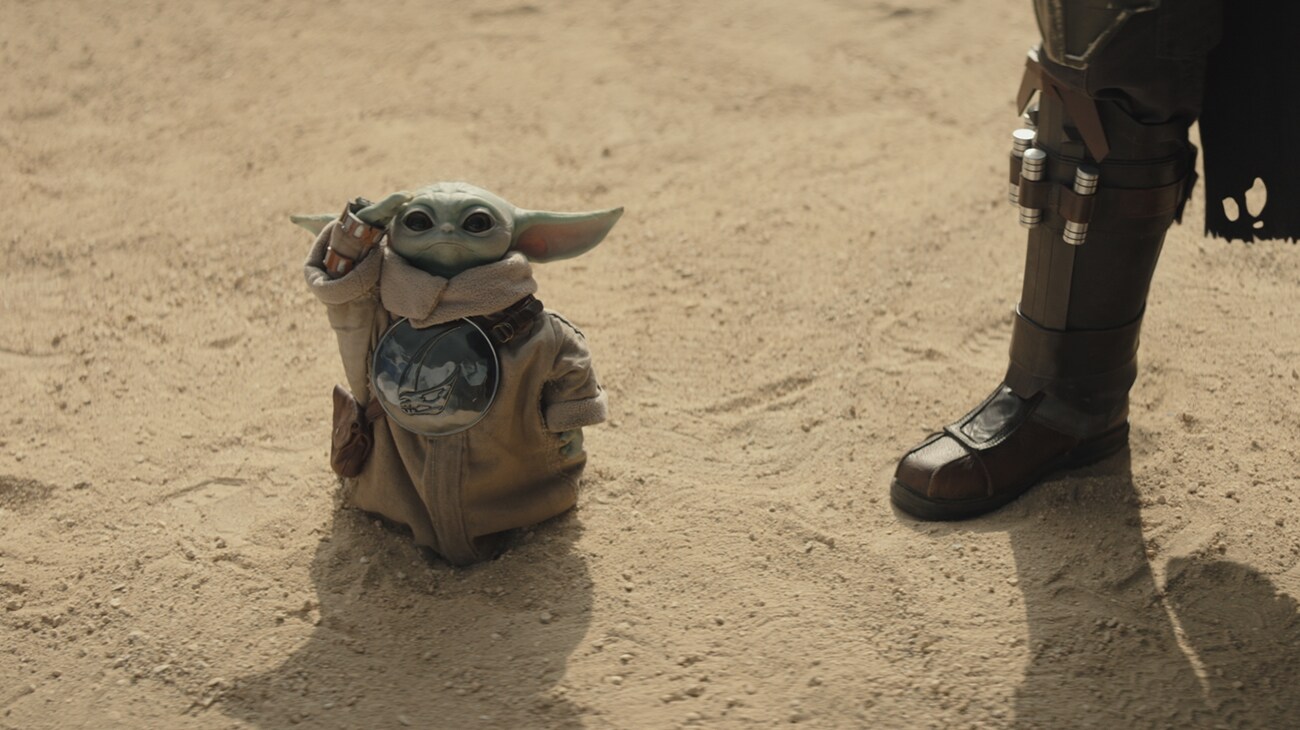 (L-R) Grogu and The Mandalorian (Pedro Pascal) in Lucasfilm's THE MANDALORIAN AND GROGU. Photo courtesy of Lucasfilm. © 2026 Lucasfilm Ltd™. All Rights Reserved.