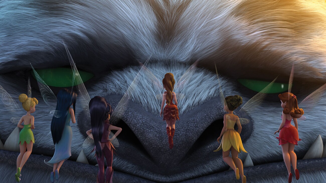 The NeverBeast closes its eyes as the fairies watch on.