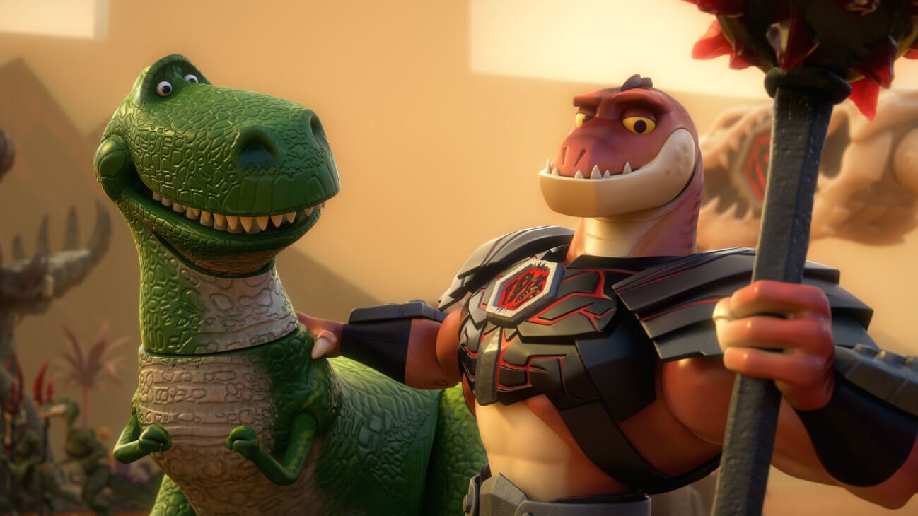 Reptillus Maximus (Kevin McKidd) places his hand on the shoulder of Rex (Wallace Shawn) in Toy Story That Time Forgot (2014).