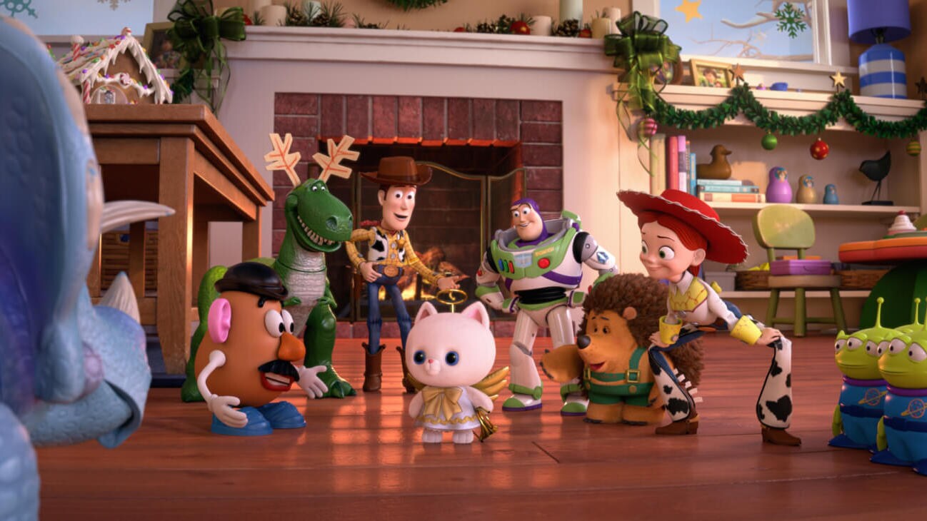 (L - R) Mr. Potato Head (Don Rickles), Rex (Wallace Shawn), Sheriff Woody (Tom Hanks), Buzz Lightyear (Tim Allen), Mr. Pricklepants (Timothy Dalton), and Jessie (Joan Cusack) praise Angel Kitty in Toy Story That Time Forgot (2014).