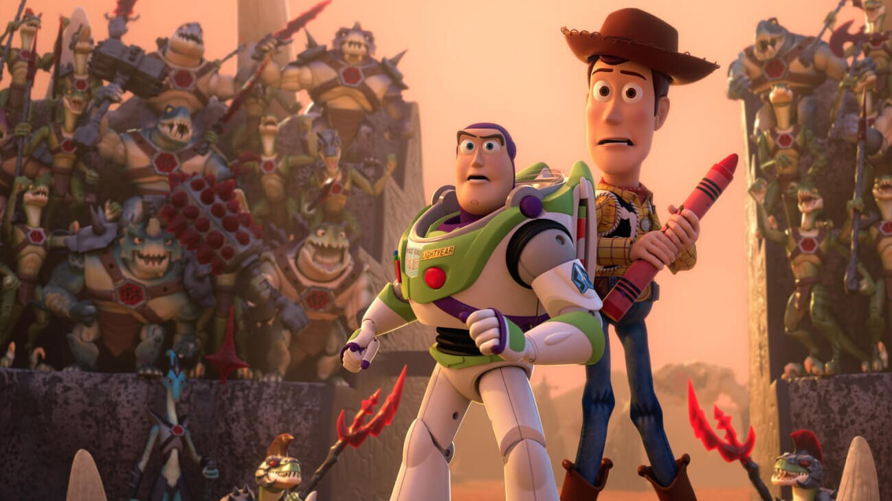 Buzz Lightyear (Tim Allen) and Sheriff Woody (Tom Hanks) are forced into the gladiator arena as a crowd of Battlesaurs cheer in Toy Story That Time Forgot (2014).