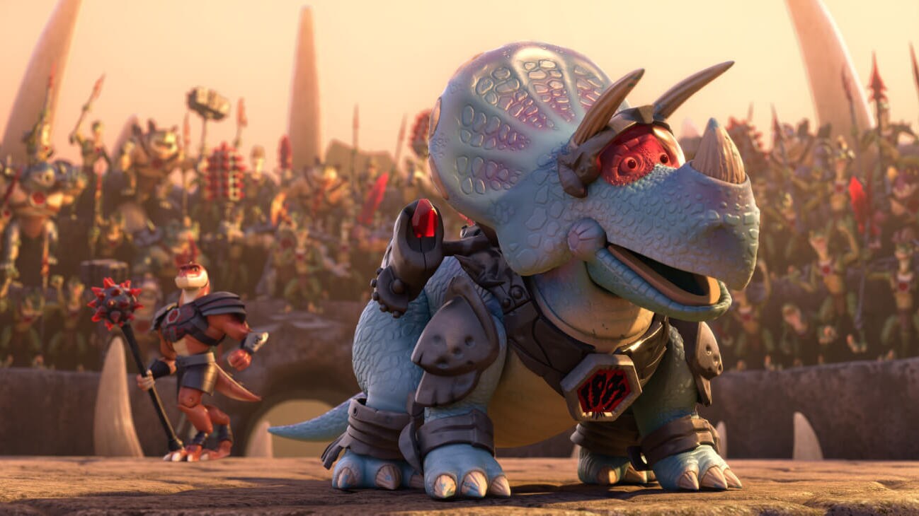 An armored Trixie (Kristen Schaal) joins Reptillus Maximus (Kevin McKidd) in the gladiator arena and excites the crowd of Battlesaurs in Toy Story That Time Forgot (2014).