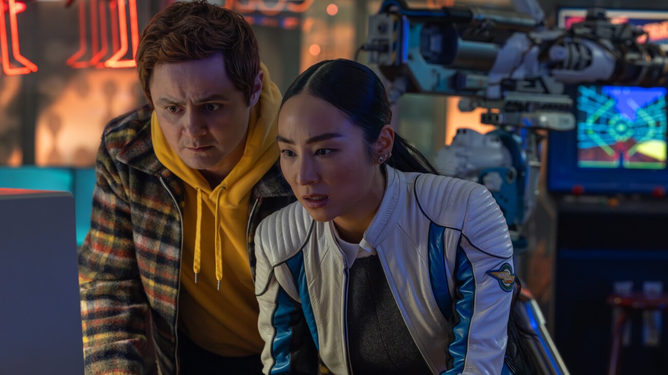 (R) Greta Lee as Eve Kim in Disney's Live Action TRON: ARES. Photo by Leah Gallo. © 2025 Disney Enterprises, Inc. All Rights Reserved.