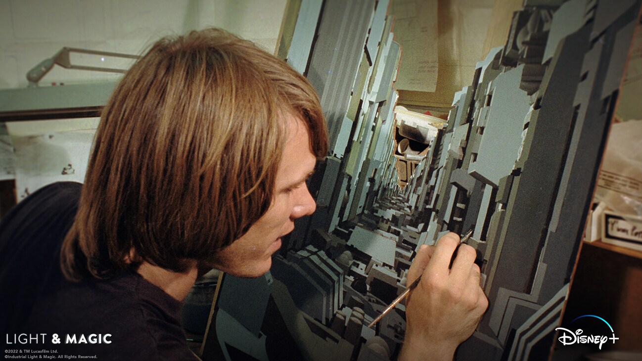 ILM artist painting a matte painting of the Death Star trench from the Disney+ Original series, "Light & Magic". | © & ™ Lucasfilm Ltd. ©Industrial Light & Magic. All Rights Reserved.