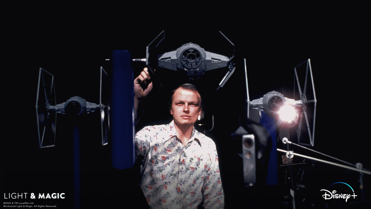 Image of a person working on several TIE fighter models from the Disney+ Original series, "Light & Magic". | © & ™ Lucasfilm Ltd. ©Industrial Light & Magic. All Rights Reserved.