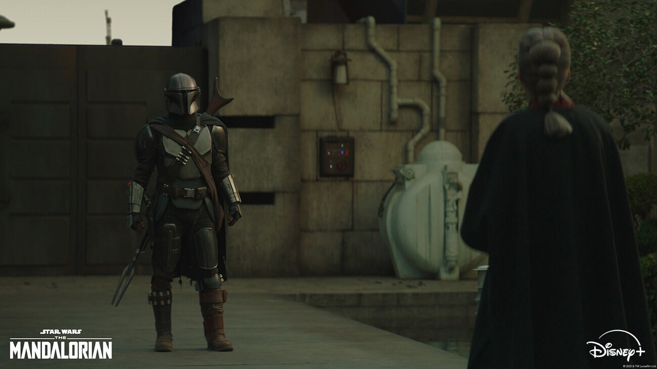 The Mandalorian (Pedro Pascal) and The Magistrate (Diana Lee Inosanto) in Lucasfilm's THE MANDALORIAN, season two, exclusively on Disney+. © 2020 Lucasfilm Ltd. & ™. All Rights Reserved.