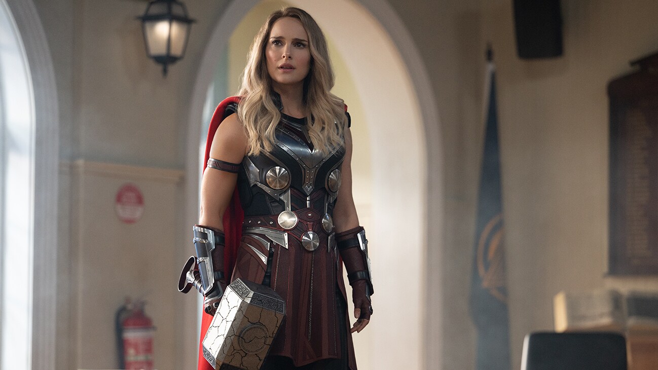 Mighty Thor (actor Natalie Portman) stares off-screen in Marvel Studios' Thor: Love and Thunder.