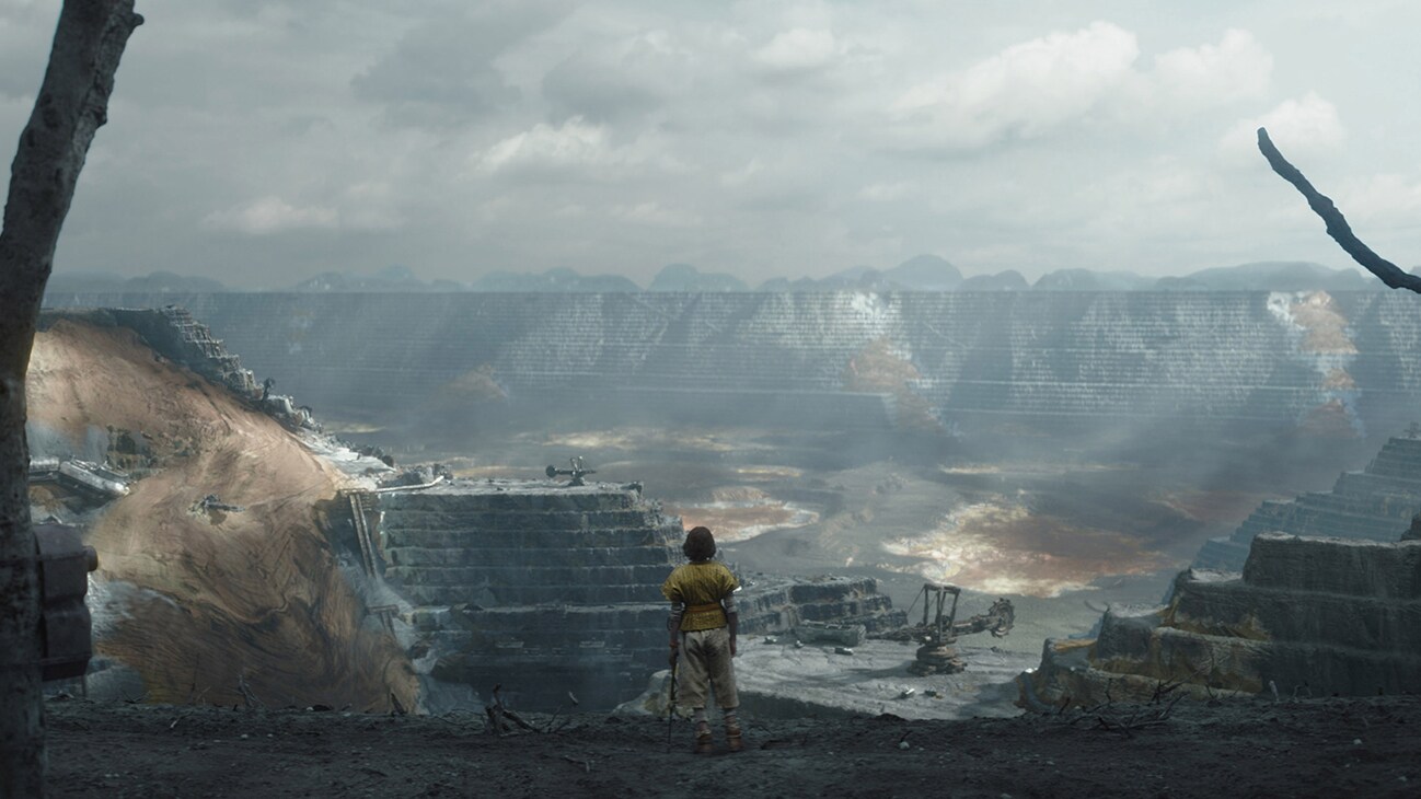 Kassa (actor Antonia Viña) standing near a cliff overlooking a valley from the Disney+ Original series, "Andor."