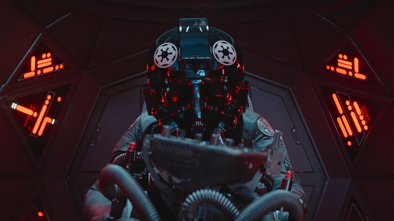 An Imperial TIE fighter pilot in a cockpit from the Disney+ Original series, "Andor."
