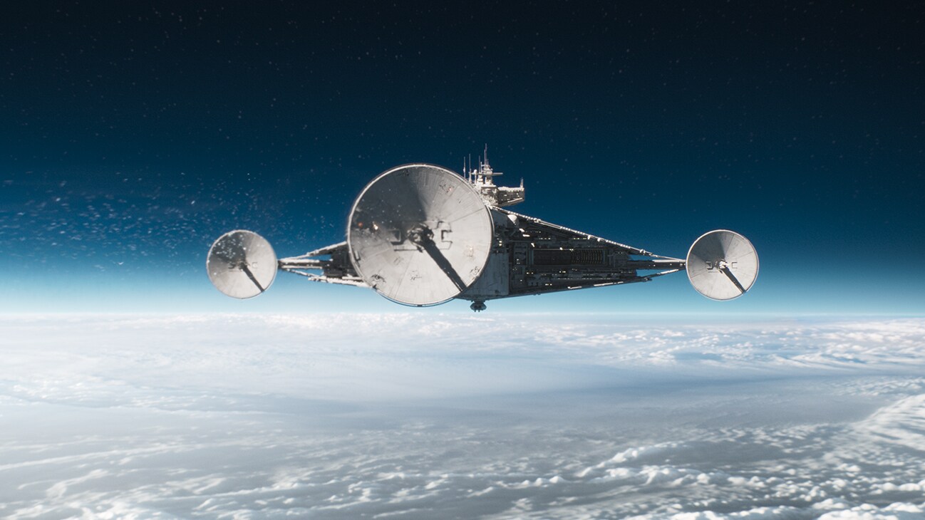 A starship with three large radio antennas orbiting a planet from the Disney+ Original series, "Andor."
