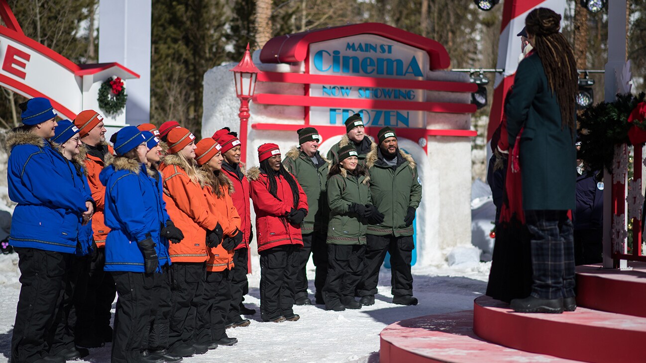 BEST IN SNOW. D'Cappella and Host Tituss Burgess speak to the snow carving teams. (Disney/Todd Wawrychuk)