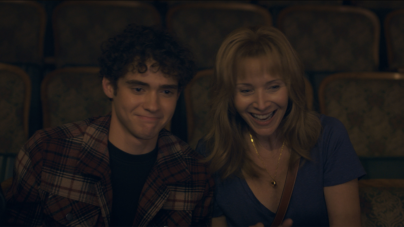 Joshua Bassett as Anthony and Lisa Kudrow as Heidi in 20th Century Studios' BETTER NATE THAN EVER, exclusively on Disney+. Photo courtesy of 20th Century Studios. © 2022 Disney Enterprises, Inc. All Rights Reserved. 
