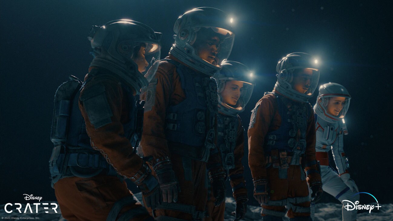 Several kids in spacesuits looking down from the Disney+ Original movie, "Crater."