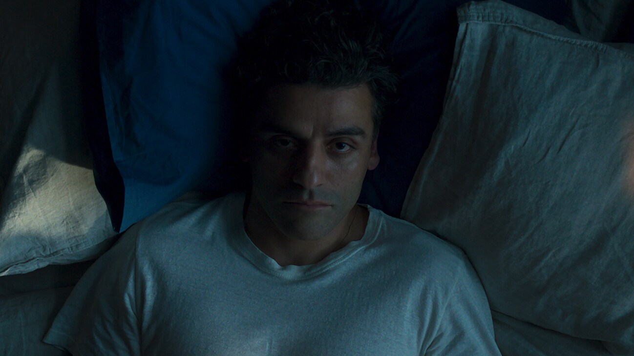 Image of Steven Grant (actor Oscar Isaac) lying down staring up from Marvel Studios' "Moon Knight".