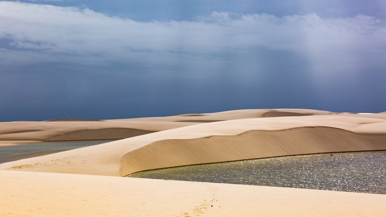 Lagoons in sand dunes. (National Geographic for Disney+/Jody Bourton)