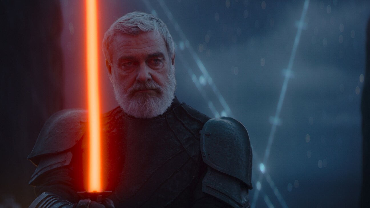 An image of a bearded man holding a lightsaber from the Disney+ Original series, "Star Wars: Ahsoka."