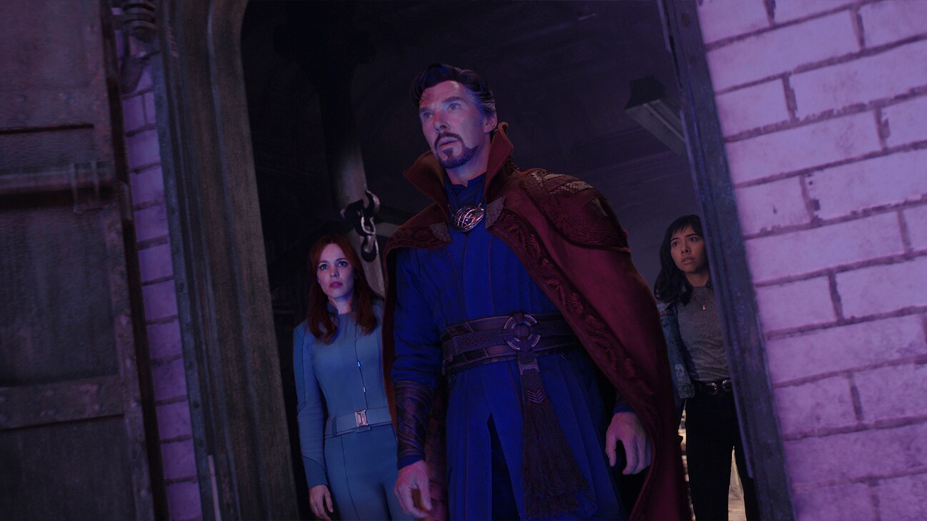 Doctor Strange (actor Benedict Cumberbatch), Christine Palmer (actor Rachel McAdams) and America Chavez (actor Zochitl Gomez) stare off into the distance in Marvel Studios' Doctor Strange in the Multiverse of Madness.