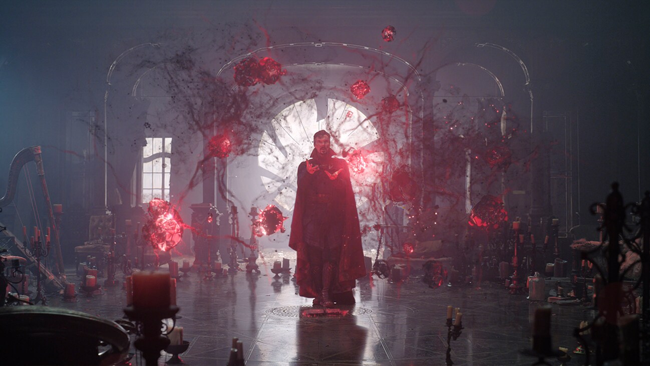 Doctor Strange (actor Benedict Cumberbatch) controls glowing red orbs in Marvel Studios' Doctor Strange in the Multiverse of Madness.