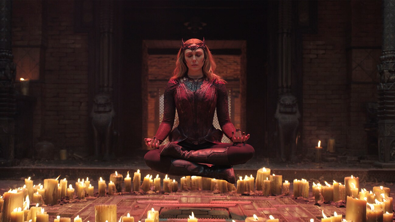 Wanda Maximoff (actor Elizabeth Olsen) meditates, floating off the ground Marvel Studios' Doctor Strange in the Multiverse of Madness.