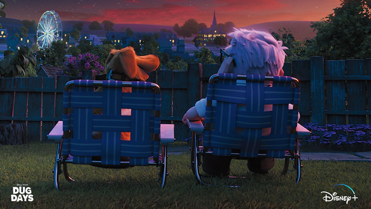 Dug (voice of Bob Peterson) and Carl (voice of Edward Asner) sitting on lawn chairs outside at night from the Disney+ Original series, "Dug Days".