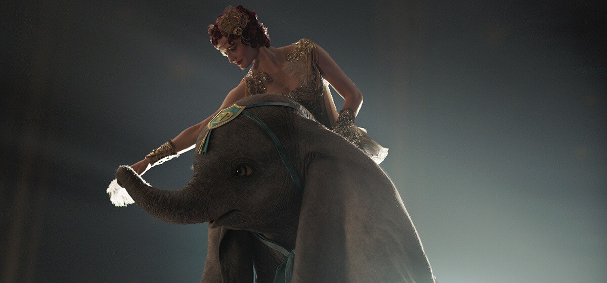 Eva Green (Colette Marchant) rides on Dumbo