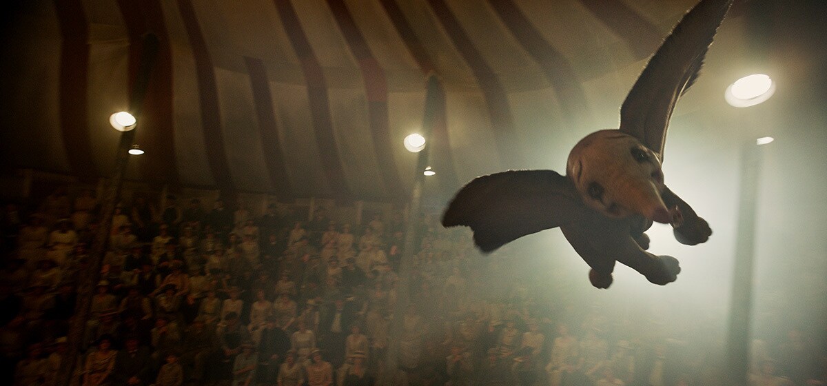 Dumbo flies in the Medici Brothers Circus tent from the movie "Dumbo"