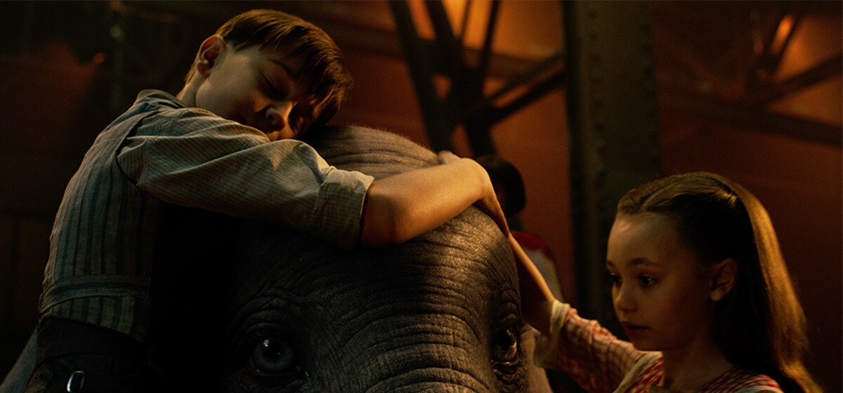 Finley Hobbins (Joe Farrier) and Nico Parker (Milly Farrier) hug Dumbo