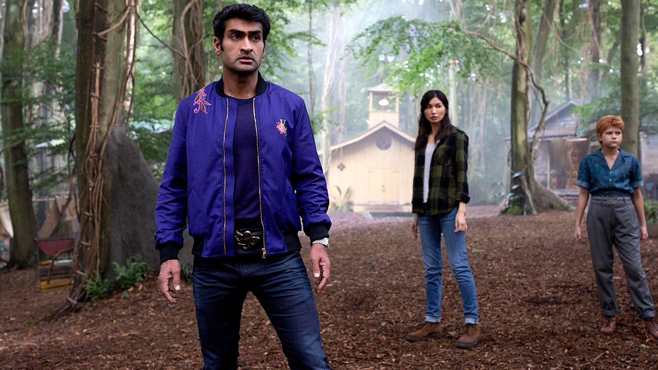 Kingo (actor Kumail Nanjiani), Sersi (actor Gemma Chan), and Sprite (actor Lia McHugh) from the Marvel Studios movie Eternals.