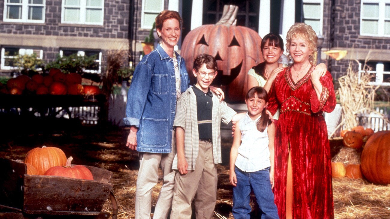 Debbie Reynolds, Kimberly J. Brown, Judith Hoag, Emily Roeske, and Joey Zimmerman from the Disney movie "Halloweentown" standing in a pumpkin patch in front of City Hall.