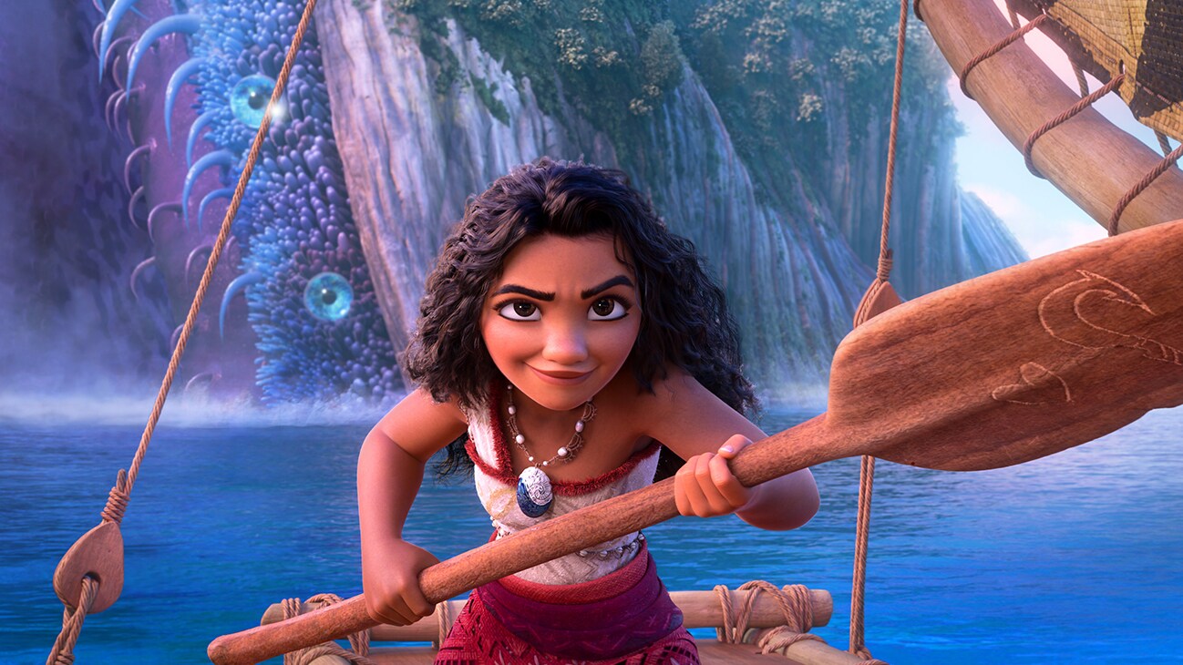Image of Moana holding an oar while on a boat from Walt Disney Animation Studios' movie, "Moana 2."