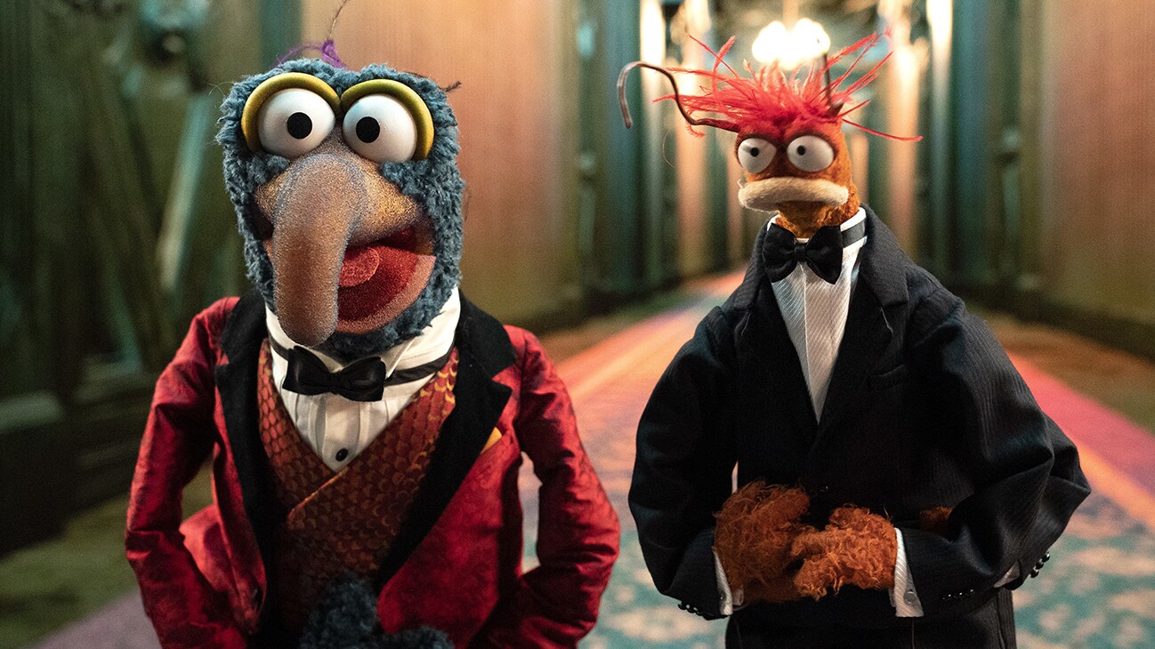 Image of Gonzo dressed in a bow tie and jacket and Pepe the King Prawn dressed in a tuxedo from the Disney movie Muppets Haunted Mansion. (Disney/Mitch Haaseth)