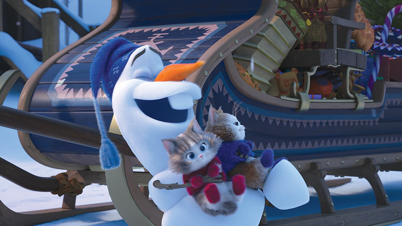 Olaf holding two kittens in "Olaf's Frozen Adventure"