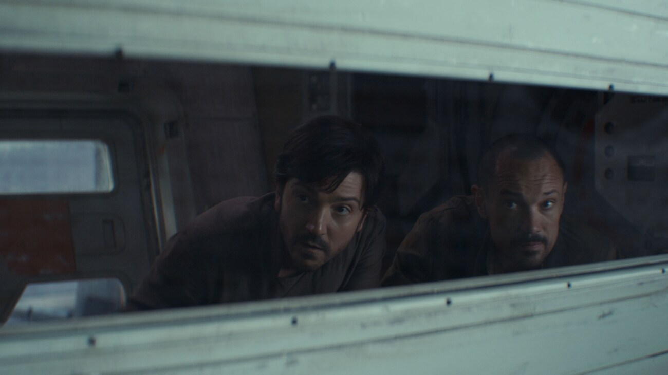 (L-R) Cassian Andor (Diego Luna) and Melshi (Duncan Pow) in Lucasfilm's ANDOR Season 2, exclusively on Disney+. Photo courtesy of Lucasfilm. ©2025 Lucasfilm Ltd. & TM. All Rights Reserved.