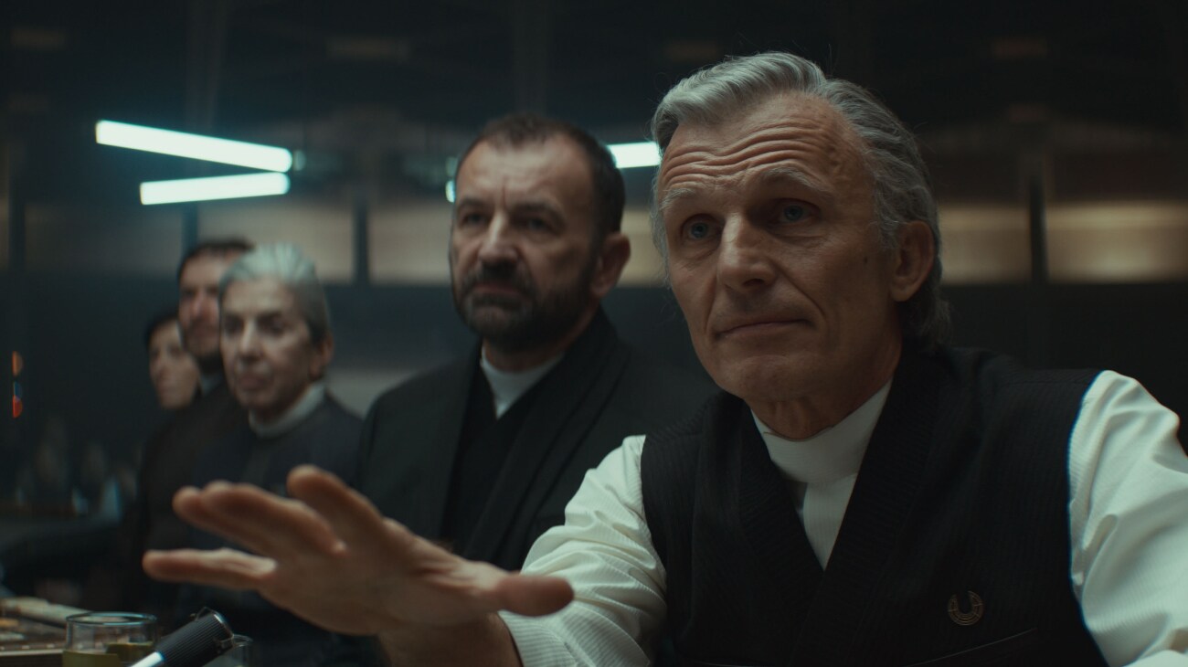 (L-R) Elector (David Bertrand) and Carro Rylanz (Richard Sammel) in Lucasfilm's ANDOR Season 2, exclusively on Disney+. Photo courtesy of Lucasfilm. ©2025 Lucasfilm Ltd. & TM. All Rights Reserved.
