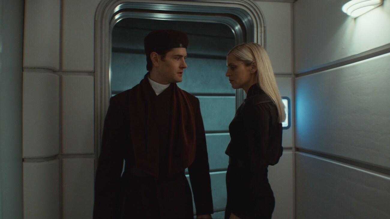 (L-R) Syril Karn (Kyle Soller) and Supervisor Dedra Meero (Denise Gough) in Lucasfilm's ANDOR Season 2, exclusively on Disney+. Photo courtesy of Lucasfilm. ©2025 Lucasfilm Ltd. & TM. All Rights Reserved.
