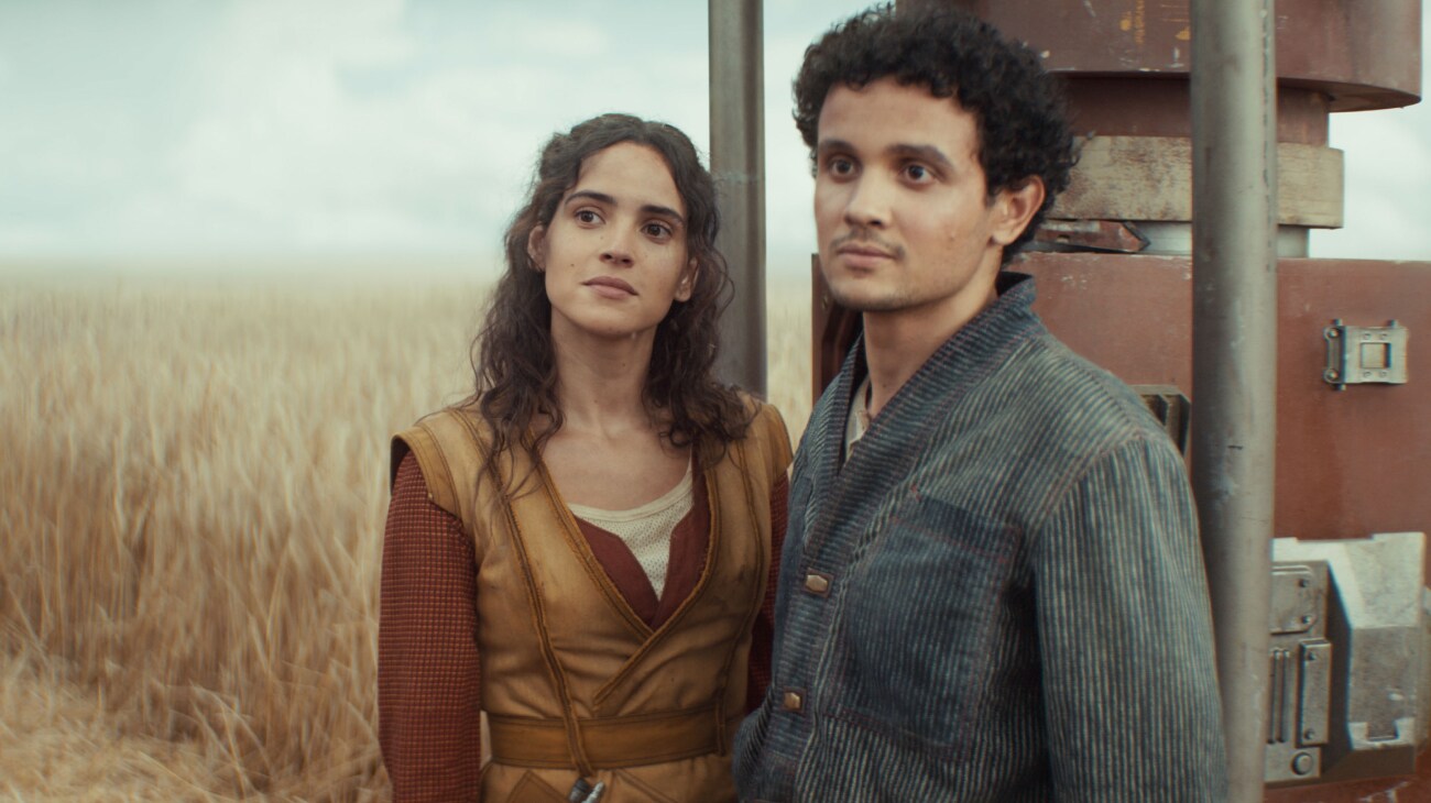 (L-R) Bix Caleen (Adria Arjona) and Wilmon Paak (Muhannad Bhaier) in Lucasfilm's ANDOR Season 2, exclusively on Disney+. Photo courtesy of Lucasfilm. ©2025 Lucasfilm Ltd. & TM. All Rights Reserved.
