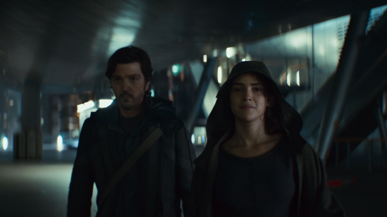 (L-R) Cassian Andor (Diego Luga) and Bix Caleen (Adria Arjona) in Lucasfilm's ANDOR Season 2, exclusively on Disney+. Photo courtesy of Lucasfilm. ©2025 Lucasfilm Ltd. & TM. All Rights Reserved.	