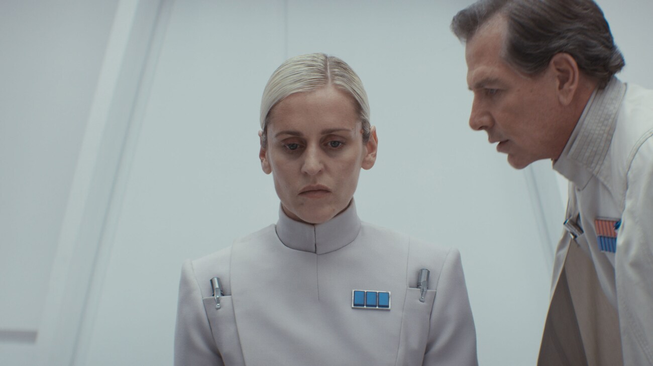 (L-R) Supervisor Dedra Meero (Denise Gough) and Director Orson Krennic (Ben Mendelsohn) in Lucasfilm's ANDOR Season 2, exclusively on Disney+. Photo courtesy of Lucasfilm. ©2025 Lucasfilm Ltd. & TM. All Rights Reserved.